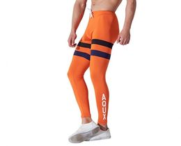 Фото - Оранжевые леггинсы для фитнеса Aqux - Men box