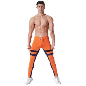 Фото - Чоловічі легінси AQUX. Колір помаранчевий. Артикул: 32-0049 - Men box